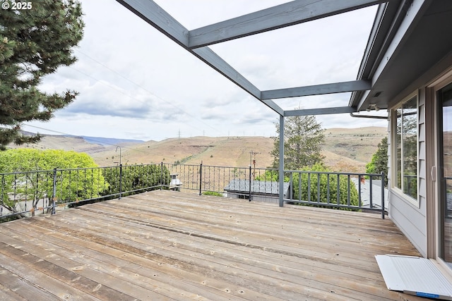 wooden deck with a mountain view