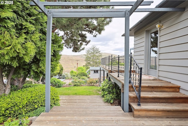 wooden terrace with a pergola