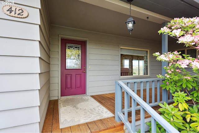 property entrance with covered porch