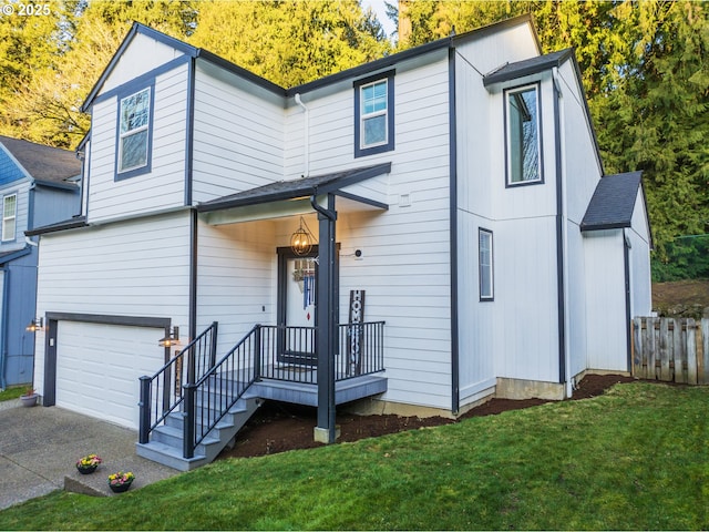 view of front of house with a garage and a front yard