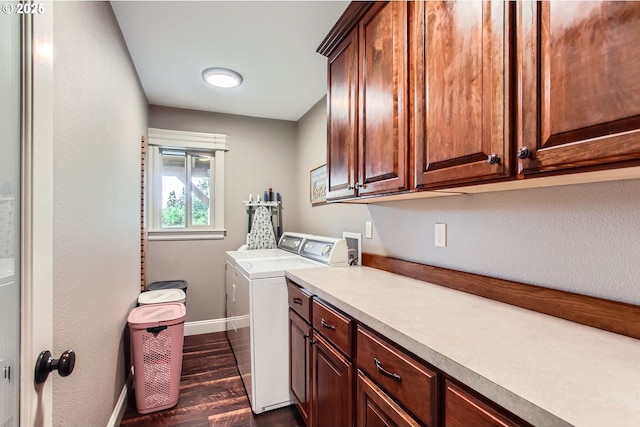 10588 Crosby Rd NE, Woodburn, OR 97071 - laundry area with cabinet space, dark wood-style flooring, washing machine and dryer, and baseboards