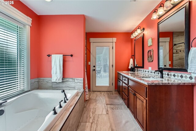 10588 Crosby Rd NE, Woodburn, OR 97071 - full bathroom featuring marble look tile flooring, a garden tub, and double vanity