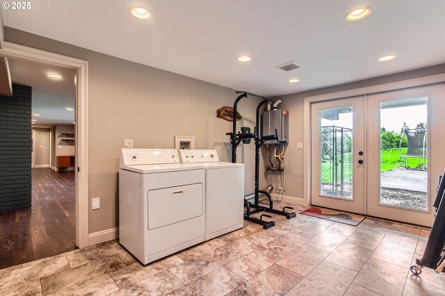 10588 Crosby Rd NE, Woodburn, OR 97071 - laundry area featuring washing machine and dryer, water heater, french doors, baseboards, and recessed lighting