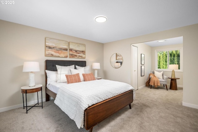 bedroom featuring carpet floors and baseboards