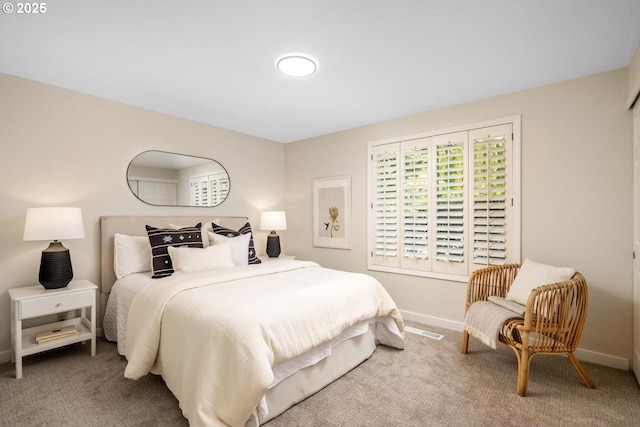 bedroom with carpet flooring and baseboards