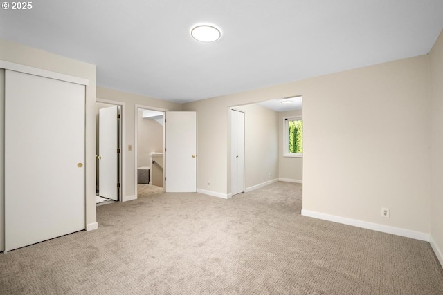 unfurnished bedroom with carpet and baseboards