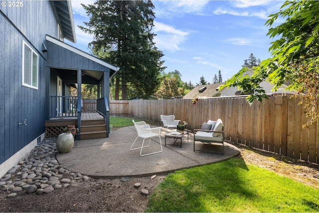 view of patio / terrace with a fenced backyard and a wooden deck