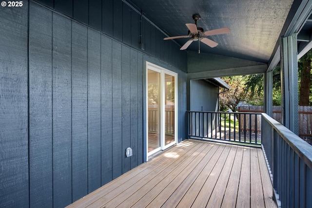 wooden terrace featuring a ceiling fan