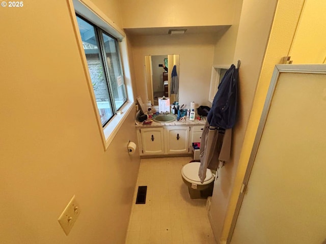 17373 SE Forest Hill Dr, Damascus, OR 97089 - bathroom featuring toilet, a sink, and tile patterned floors