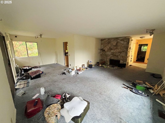 17373 SE Forest Hill Dr, Damascus, OR 97089 - unfurnished living room featuring carpet and a fireplace
