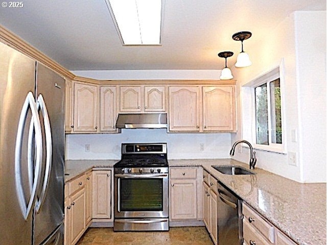 kitchen featuring light brown cabinetry, sink, and appliances with stainless steel finishes