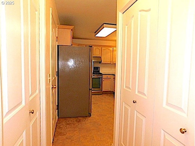 kitchen with light brown cabinets and stainless steel appliances