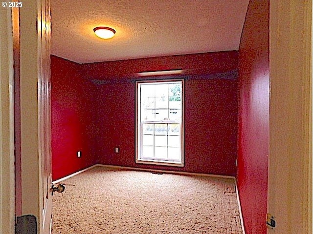 empty room with a textured ceiling