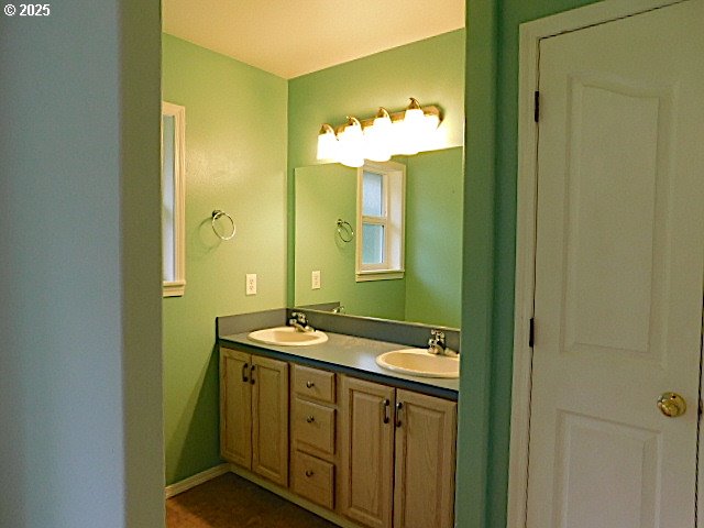 bathroom with tile patterned floors and vanity