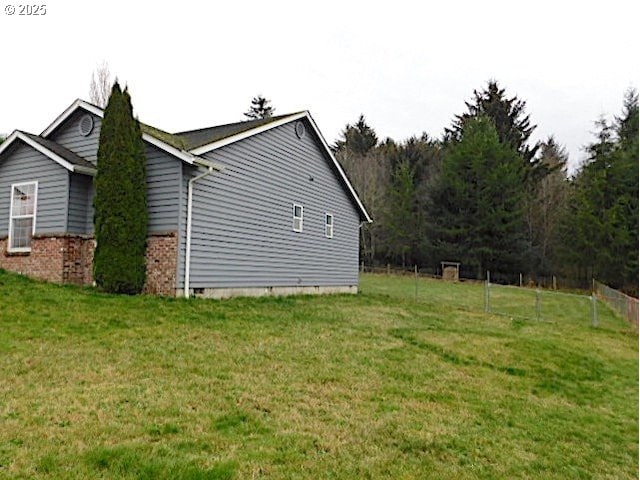 view of property exterior with a lawn