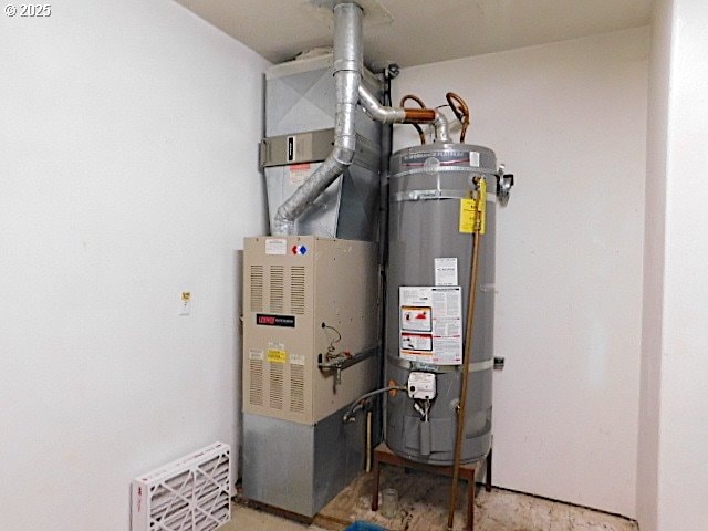 utility room with water heater