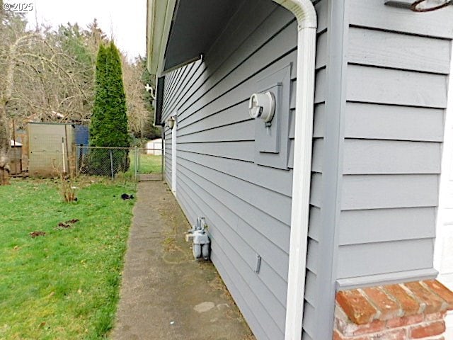 view of property exterior with a yard