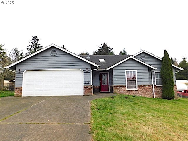 single story home with a front yard and a garage