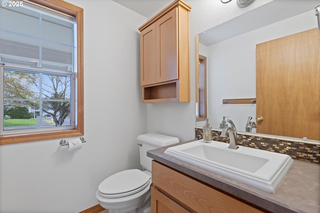 14100 SE 20th St, Vancouver, WA 98683 - half bath featuring vanity, toilet, and tasteful backsplash