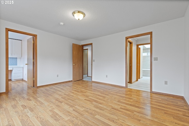 14100 SE 20th St, Vancouver, WA 98683 - spare room with light wood finished floors and baseboards