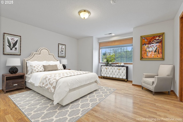 14100 SE 20th St, Vancouver, WA 98683 - bedroom featuring light wood-type flooring and baseboards