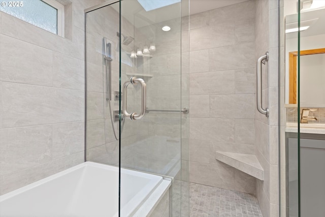 14100 SE 20th St, Vancouver, WA 98683 - bathroom featuring tiled shower, a bath, and vanity