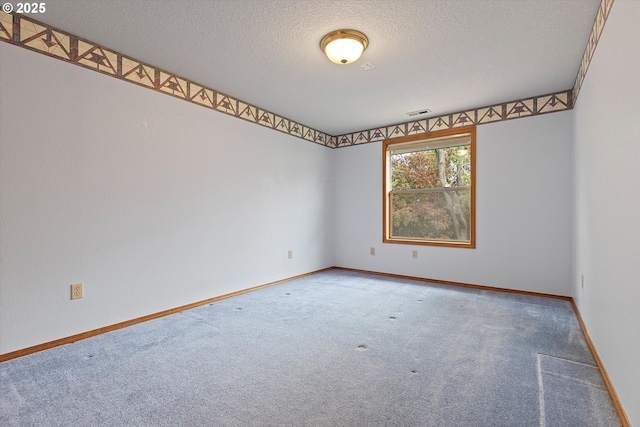 14100 SE 20th St, Vancouver, WA 98683 - carpeted spare room with a textured ceiling and baseboards