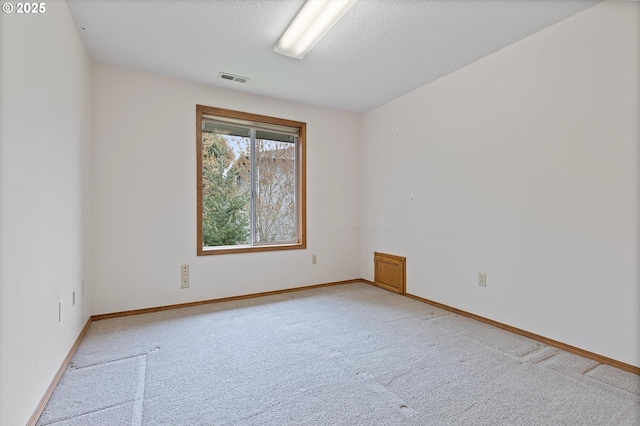 14100 SE 20th St, Vancouver, WA 98683 - empty room with light carpet, baseboards, and a textured ceiling