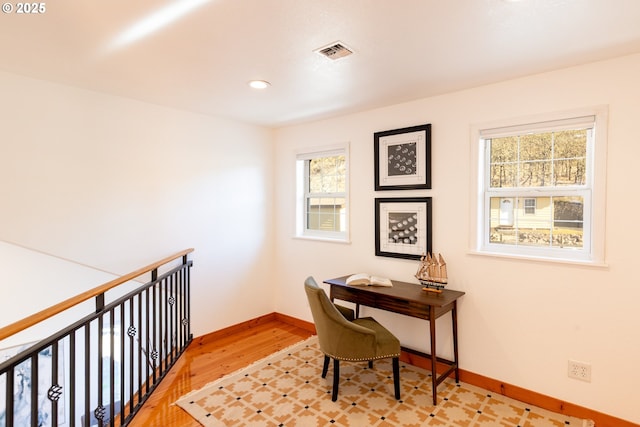 office space with baseboards, recessed lighting, visible vents, and wood finished floors