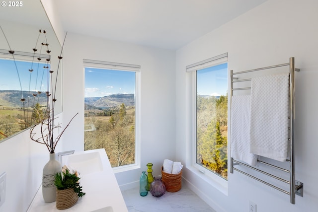 interior space with baseboards and a sink