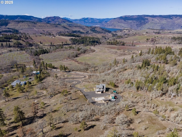 drone / aerial view featuring a rural view and a mountain view