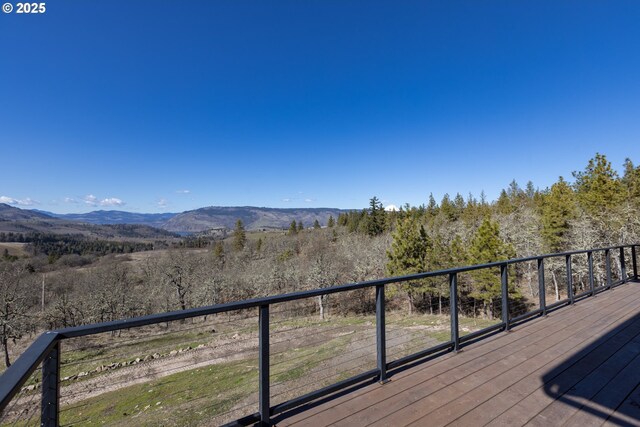 wooden deck featuring a mountain view