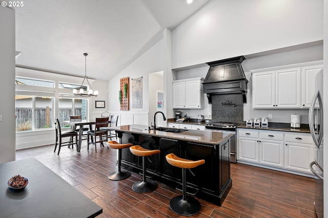 1622 Provincial Way, Eugene, OR 97401 - kitchen with appliances with stainless steel finishes, custom range hood, high vaulted ceiling, white cabinetry, and dark wood finished floors