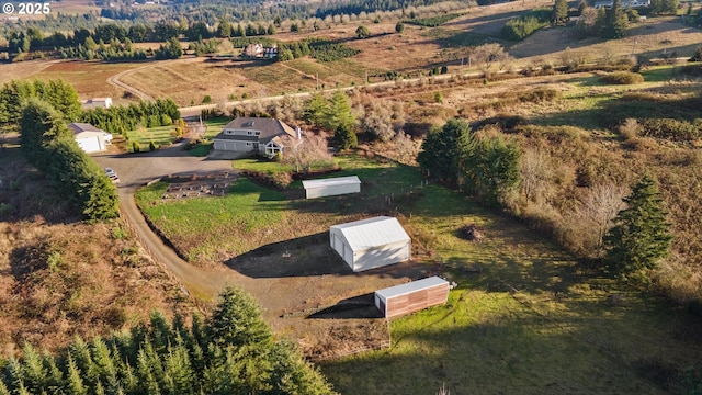 birds eye view of property featuring a rural view