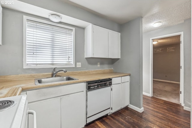 kitchen with sink, white appliances, dark wood-type flooring, a textured ceiling, and white cabinets