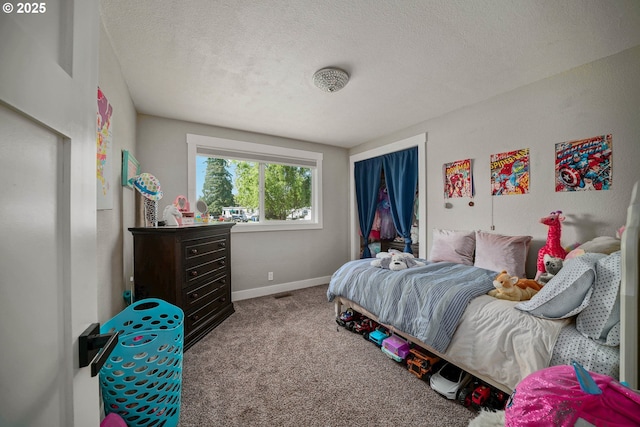 1552 59th Ave SE, Salem, OR 97317 - carpeted bedroom featuring baseboards and a textured ceiling