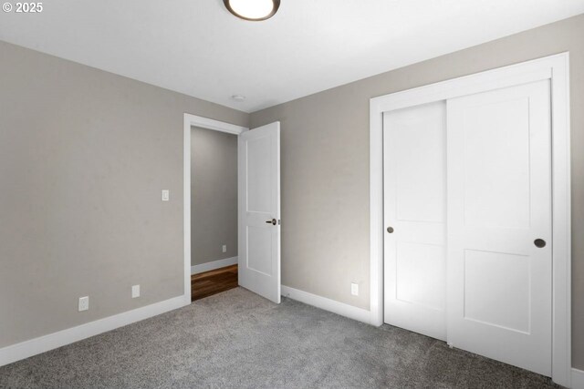 2034 45th St, Florence, OR 97439 - unfurnished bedroom with baseboards, a closet, and carpet flooring