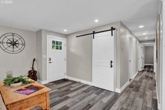2034 45th St, Florence, OR 97439 - foyer with baseboards, a barn door, wood finished floors, and recessed lighting