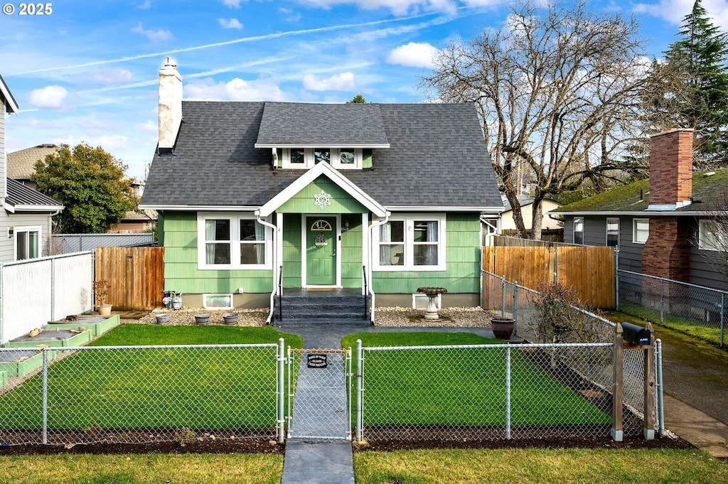 bungalow-style home featuring a front lawn