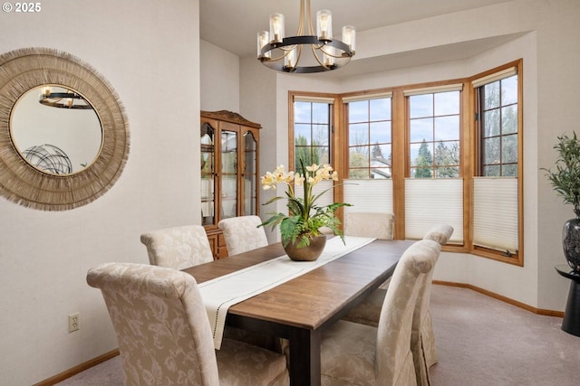 863 Fairway View Dr, Eugene, OR 97401 - dining area with a chandelier, baseboards, carpet floors, and plenty of natural light