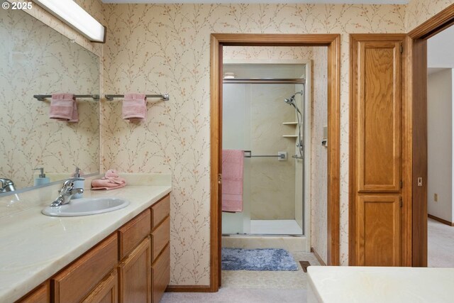 863 Fairway View Dr, Eugene, OR 97401 - full bathroom with a shower stall, vanity, baseboards, and wallpapered walls