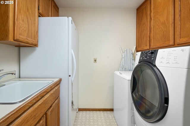 863 Fairway View Dr, Eugene, OR 97401 - clothes washing area with cabinet space, independent washer and dryer, light floors, and baseboards