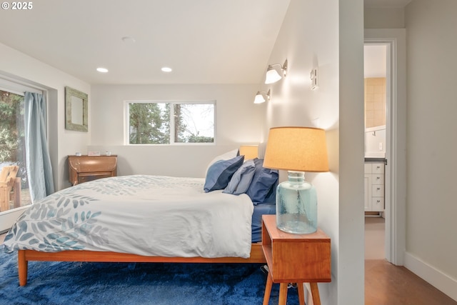 bedroom with recessed lighting, baseboards, and vaulted ceiling