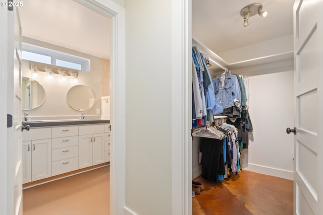 spacious closet featuring a sink