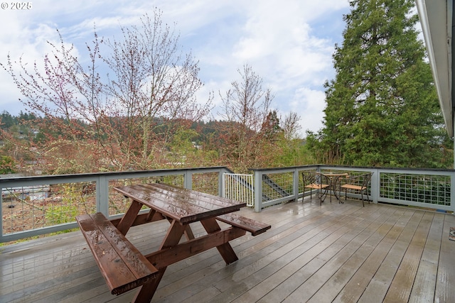 wooden deck with outdoor dining space