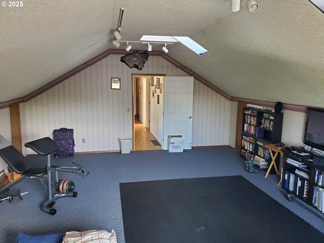 workout area with vaulted ceiling, a textured ceiling, carpet floors, crown molding, and wallpapered walls