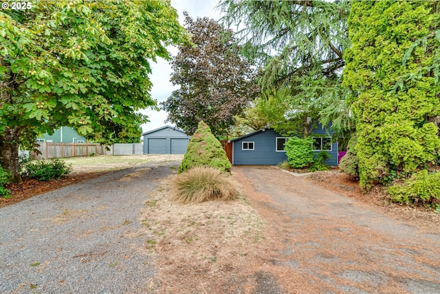 exterior space with an outdoor structure and a garage