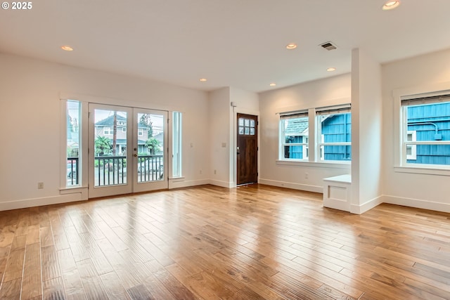 interior space with light wood-style flooring and a wealth of natural light