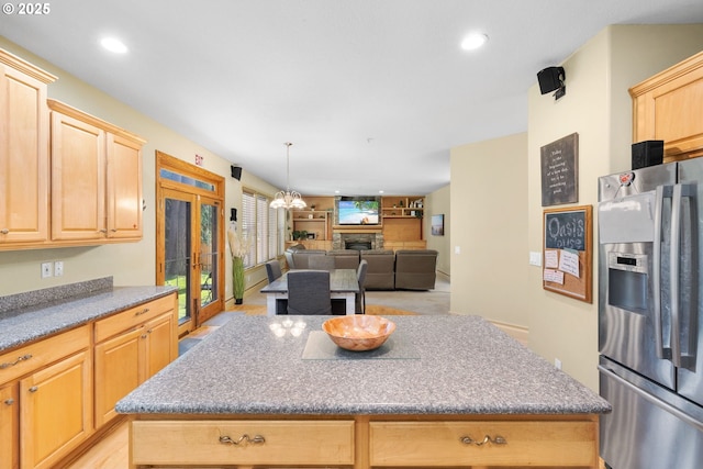 15111 Oyer Dr, Oregon City, OR 97045 - kitchen with stainless steel refrigerator with ice dispenser, light brown cabinets, a kitchen island, recessed lighting, and open floor plan