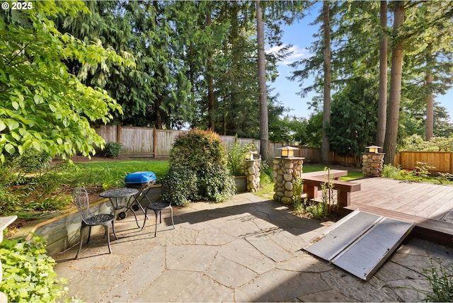 15111 Oyer Dr, Oregon City, OR 97045 - fenced backyard featuring a patio area and a wooden deck